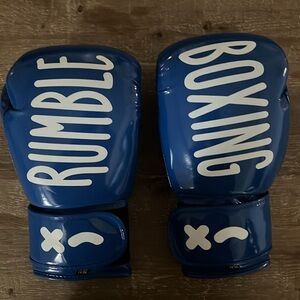 Brand new Rumble Limited Edition Boxing Gloves w/matching wraps & cinch bag